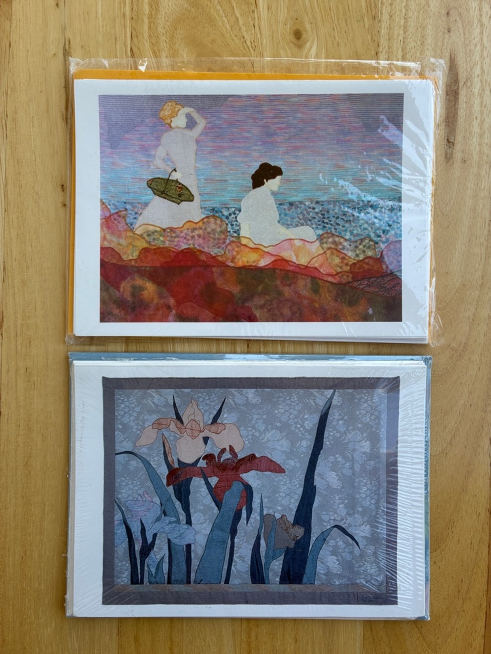 2 sealed sets of art cards.  11 cards and envelopes